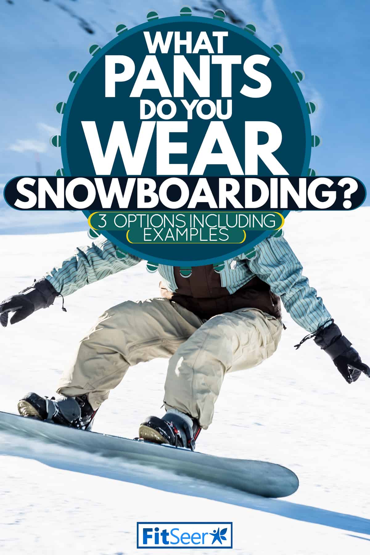 A fully geared snowboarder with a gradient colored goggles trekking on the snowy trails of a mountain side, What Pants Do You Wear Snowboarding? [3 Options inc. examples]