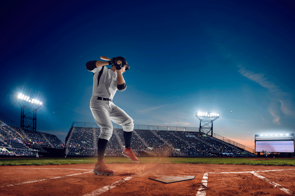 Baseball player at professional baseball stadium in evening during a game, Does Baseball Have Halftime?