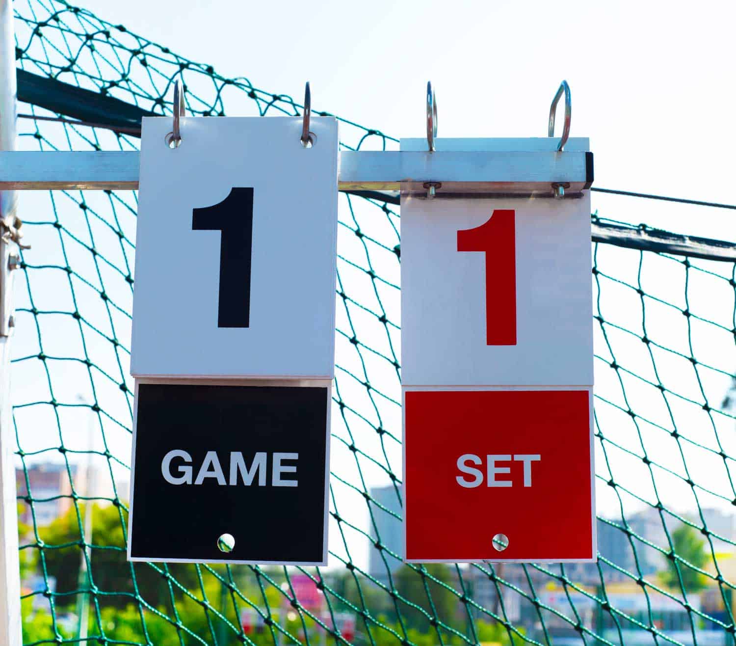 Scoreboard on a tennis court during an outdoor game
