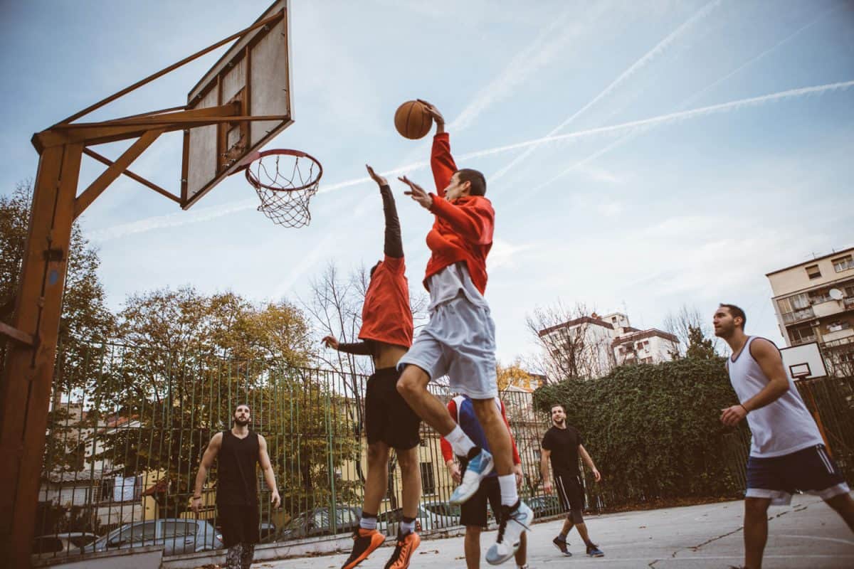 Basketball players playing basketball at the park