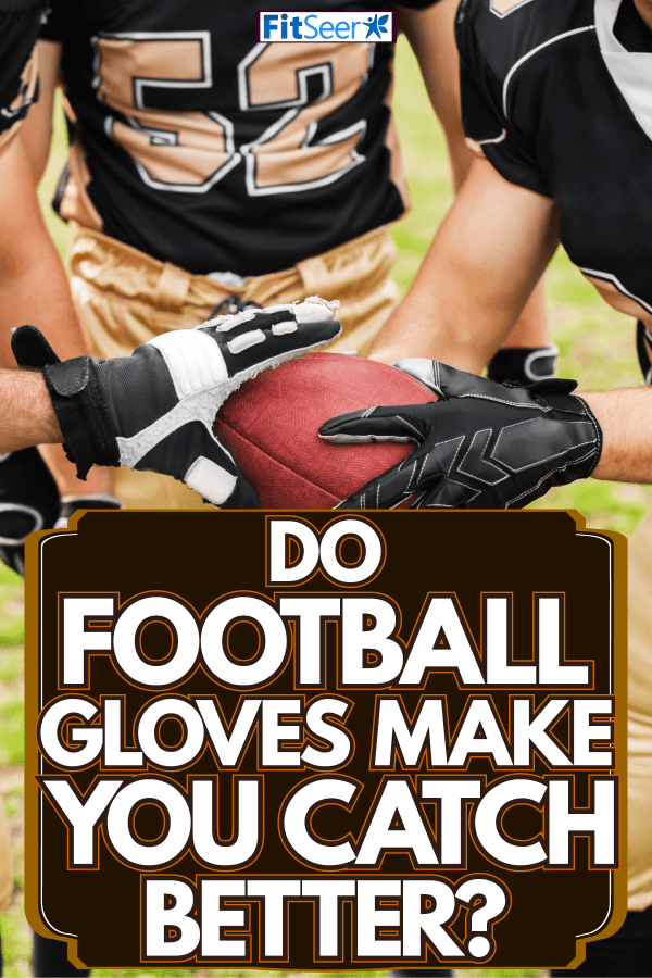 Football players holding the football on the field, Do Football Gloves Make You Catch Better?