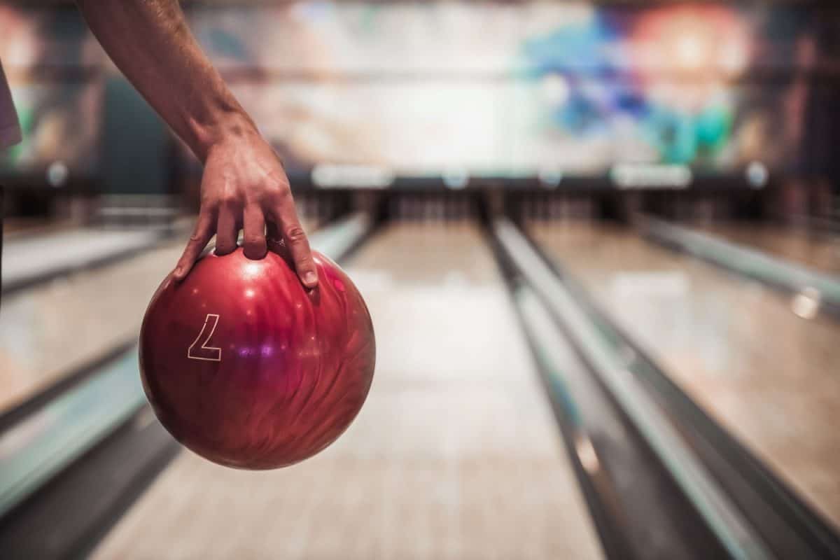 A bowling player executing a proper bowling ball hold