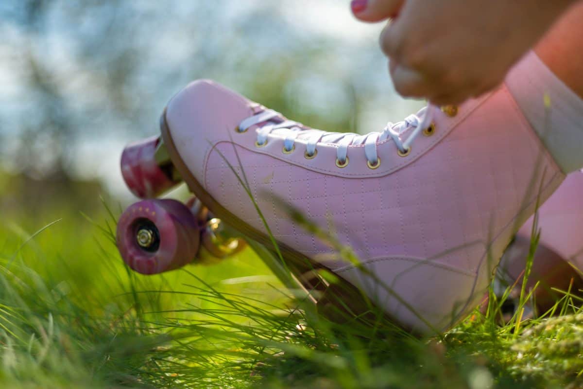 A girl showing her pink roller skates