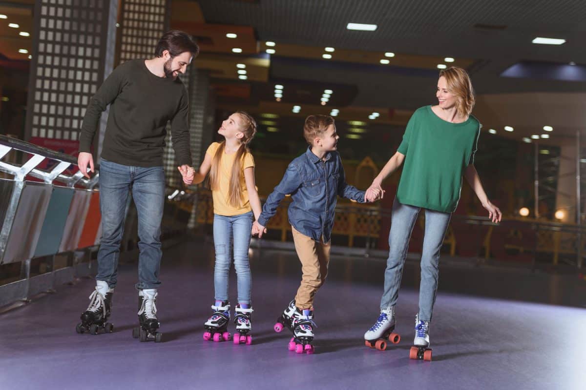 A happy family skating on the mall