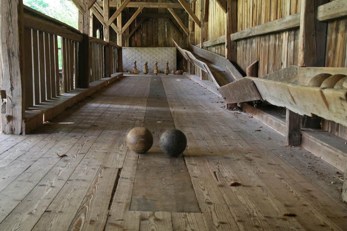 Two bowling balls placed DIY bowling alley