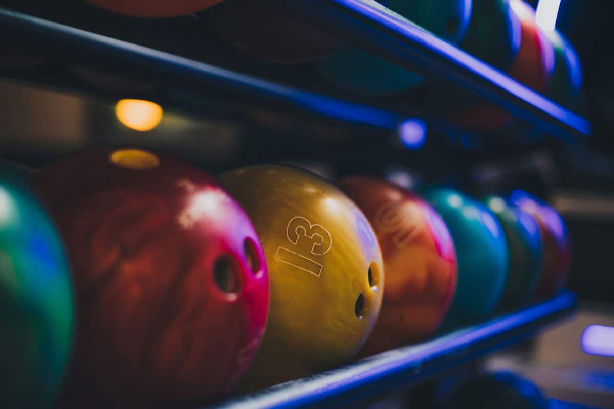 a stocks of a bowling ball in a bowling alley